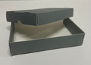A gray A5 document box made from archival boxboard, displayed open on a white surface.