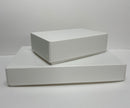 Two white polypropylene storage boxes, one large and one small, flat packed and placed one on top of the other.